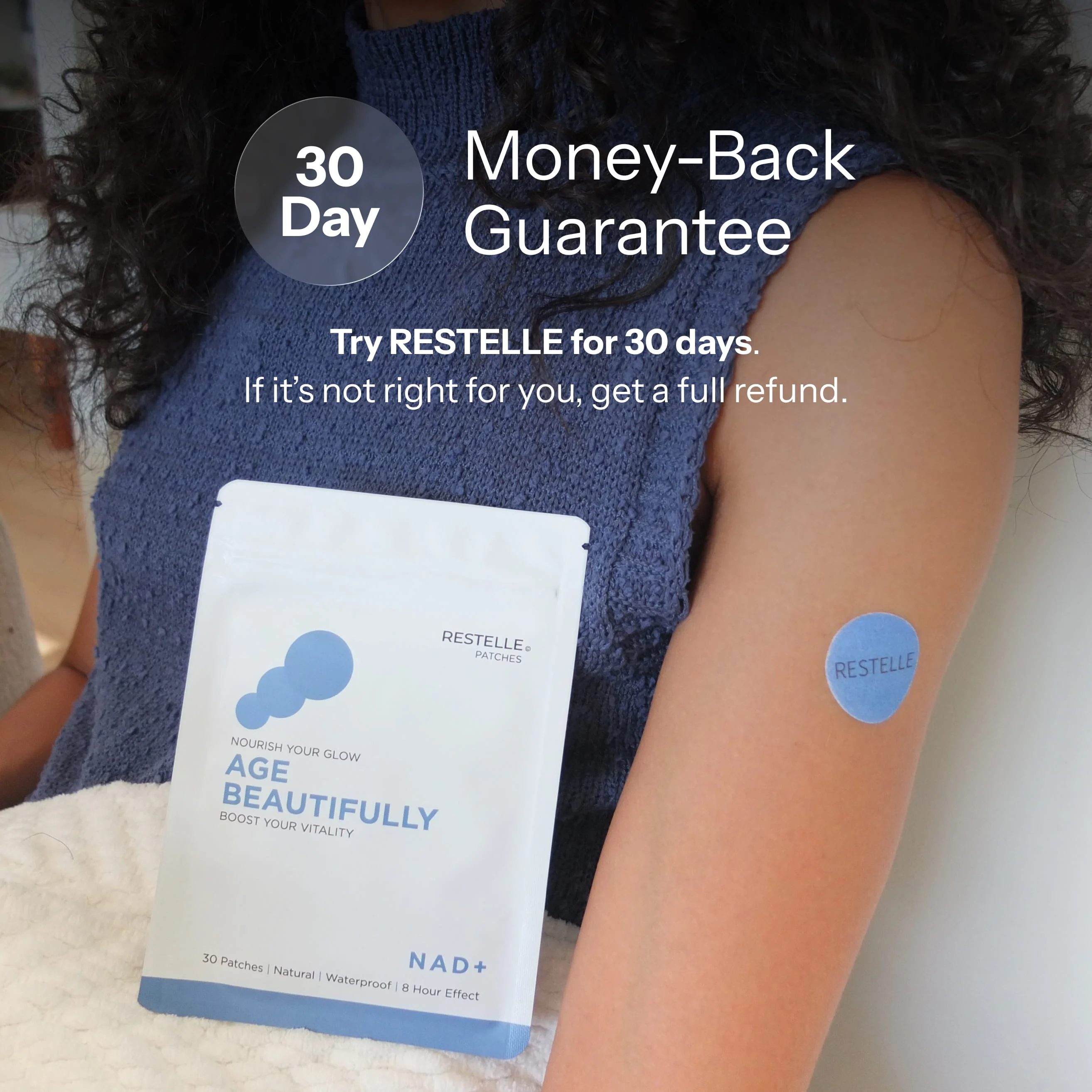 A person holding a pouch of Restelle patches with a blue patch on their upper arm.