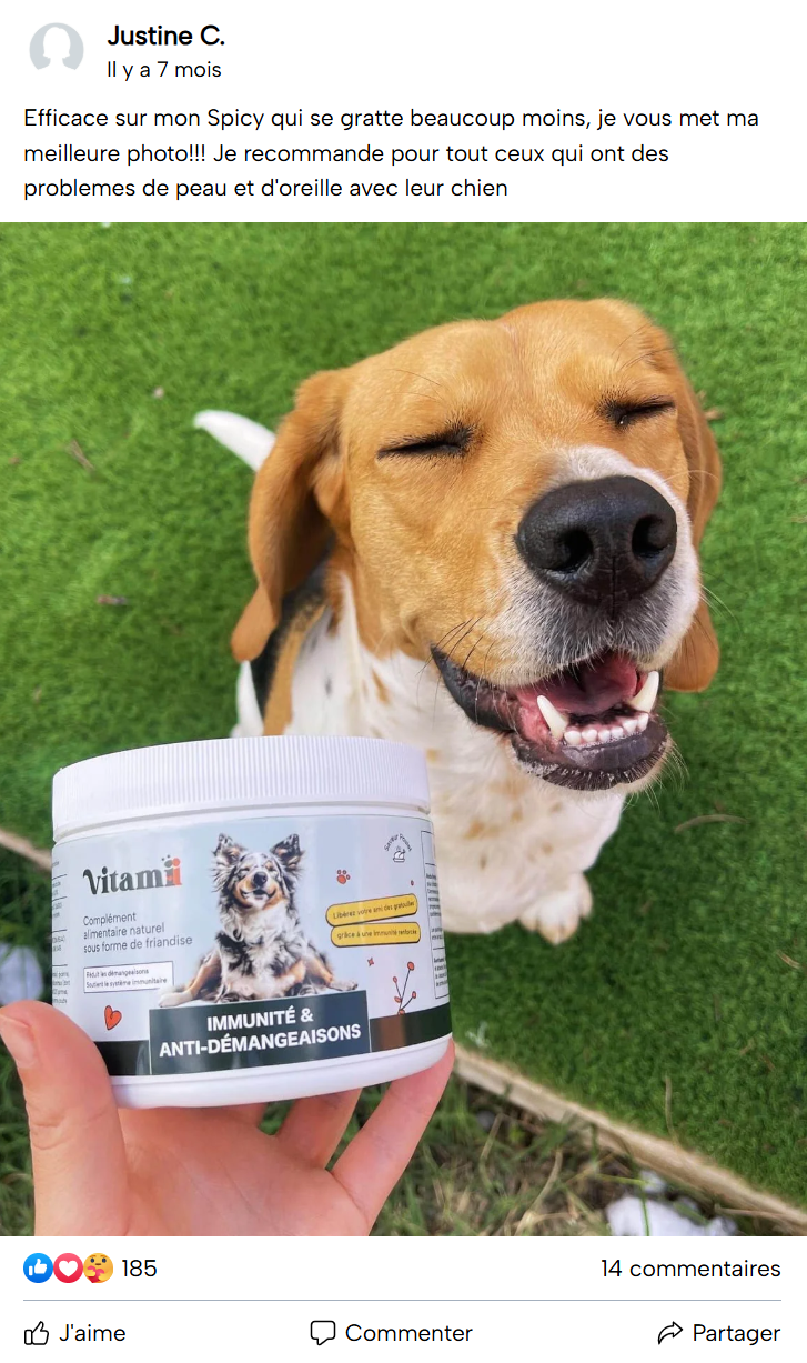 Smiling dog with eyes closed next to a container of pet supplement.