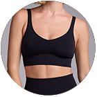 Person wearing a black sports bra and high-waisted bottoms.