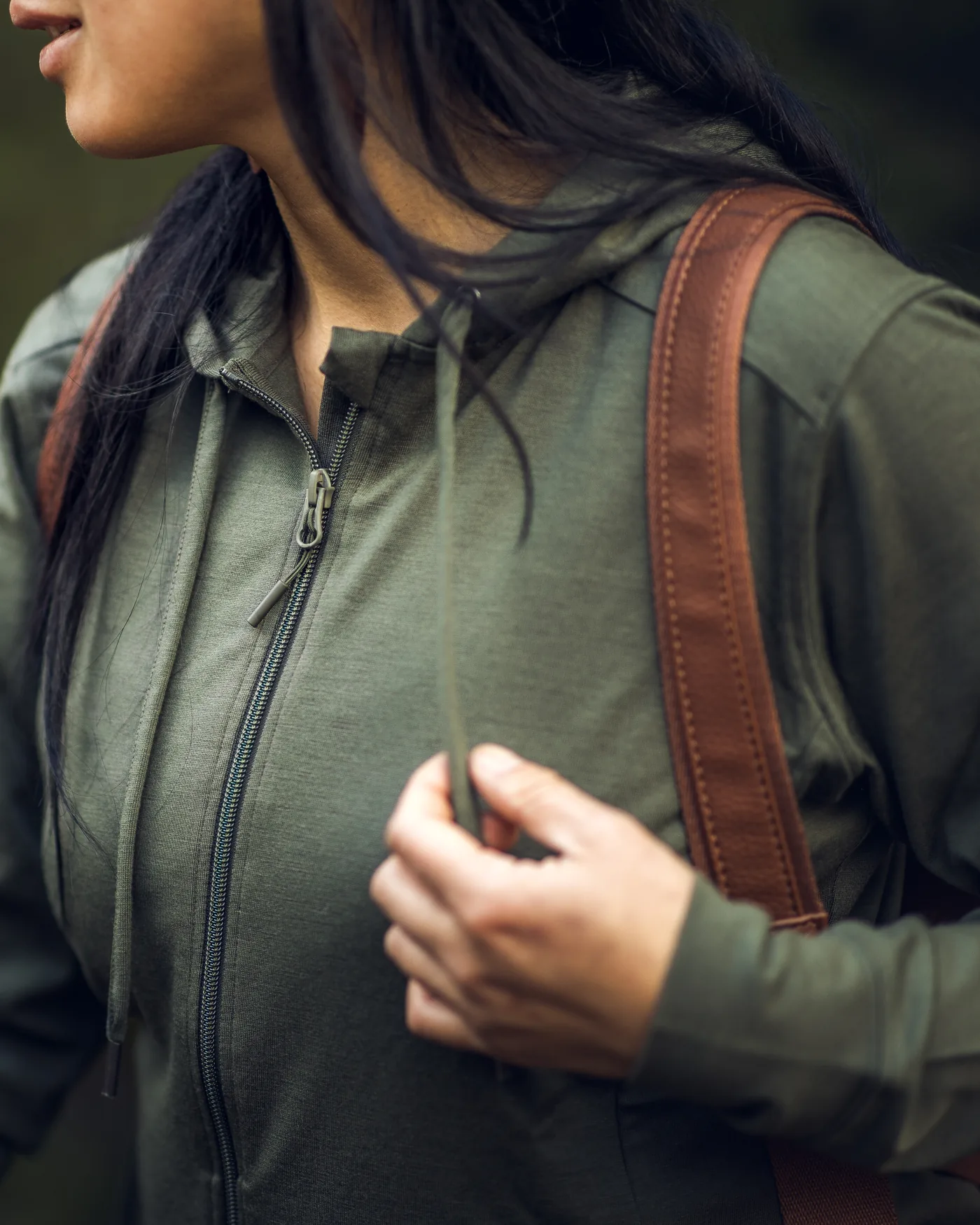 Close-up of the olive Ryann Merino Hoodie zipper and fabric