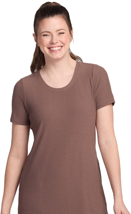 Person smiling, wearing a brown short-sleeve dress.