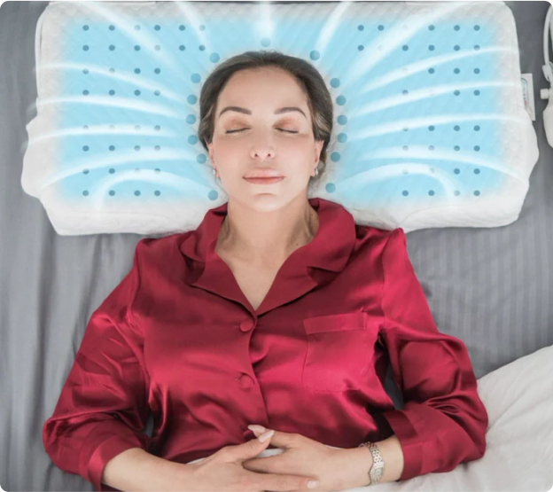 Person peacefully sleeping on a white pillow in a red shirt.