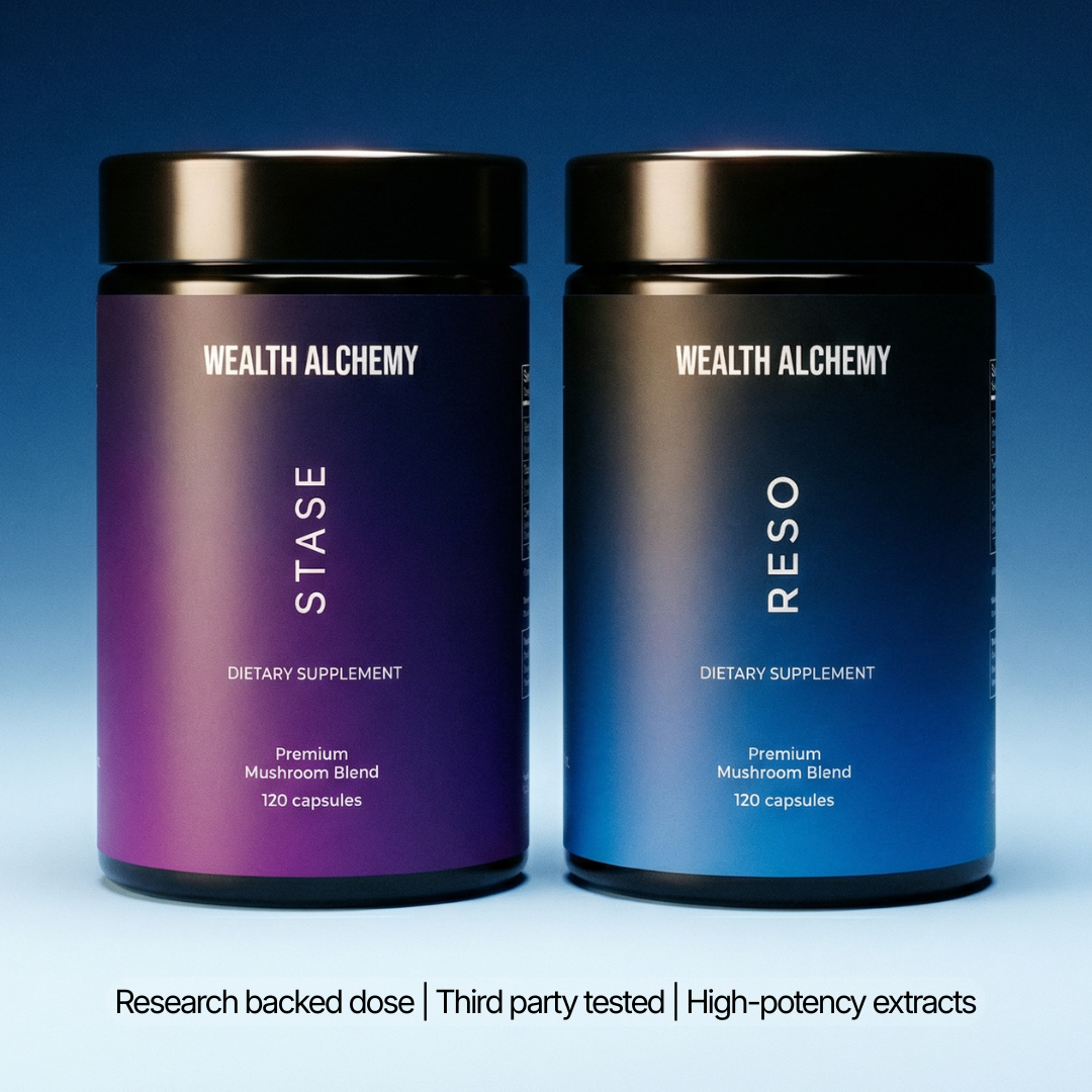 Two black bottles of Wealth Alchemy dietary supplements, one purple and one blue, against a blue background.