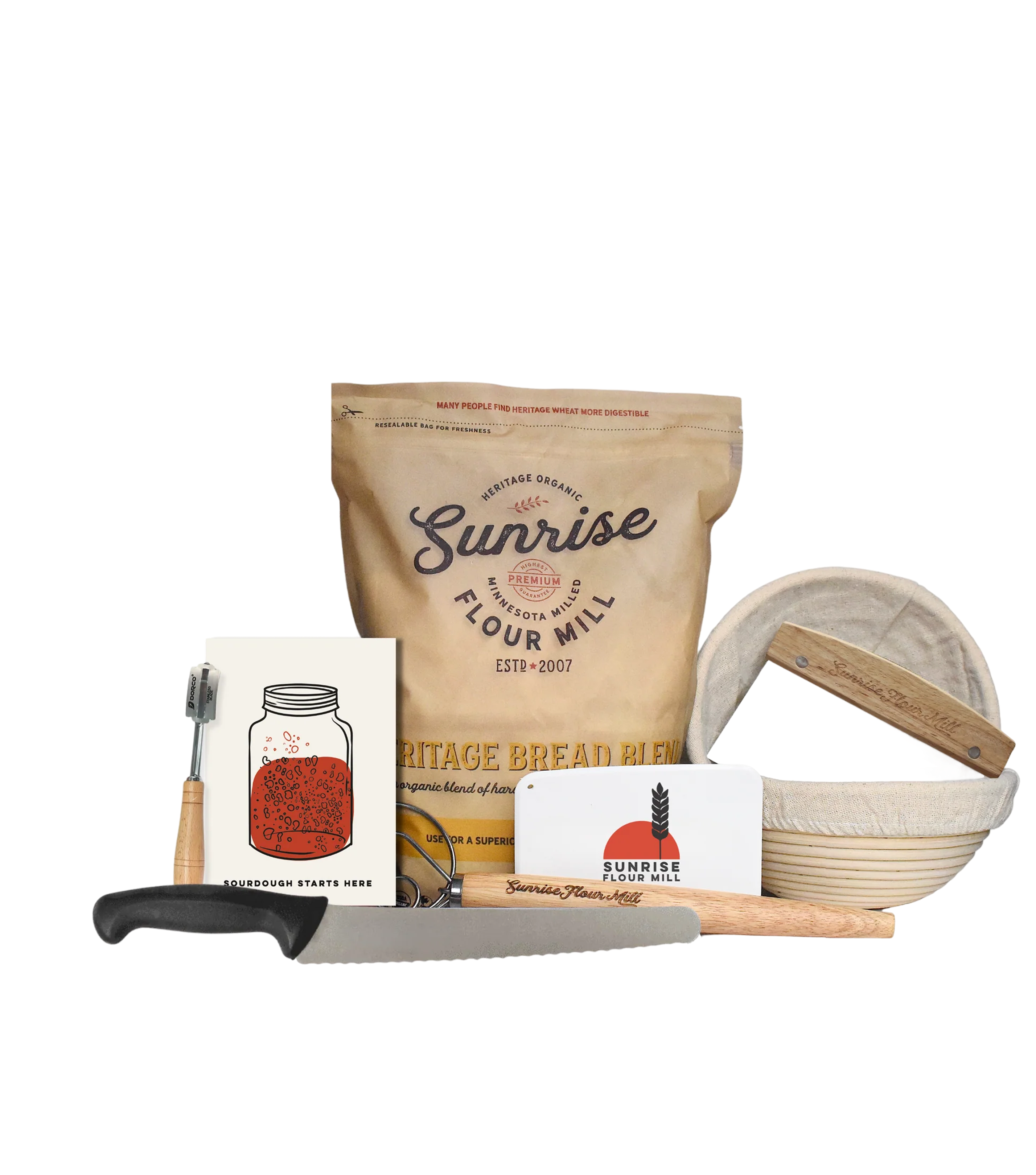 Bread-making kit with flour, bread knife, basket, and recipe pamphlet.