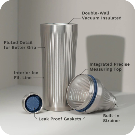 Stainless steel tumbler with labeled features: double-wall insulation, fluted grip, measuring top, and strainer.