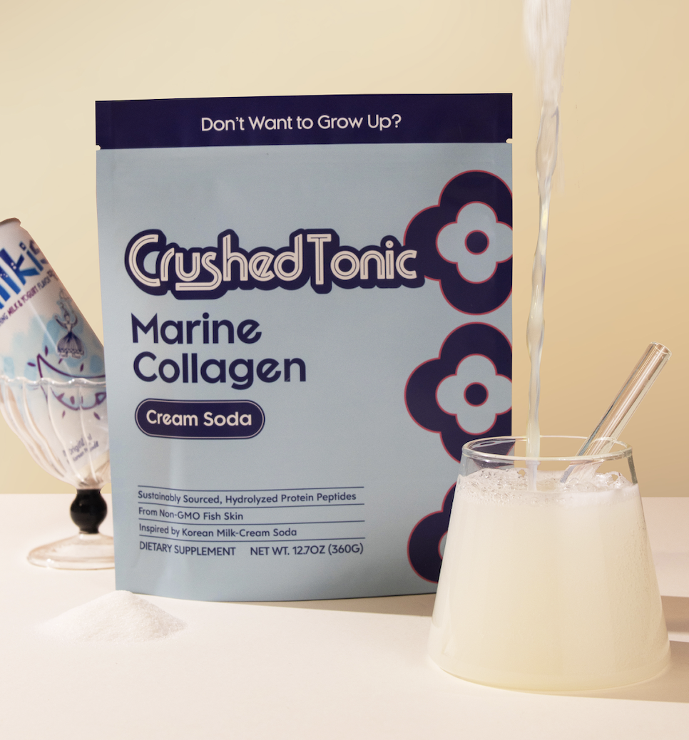 A pouch of Crushed Tonic Marine Collagen next to a glass of cream soda being poured.