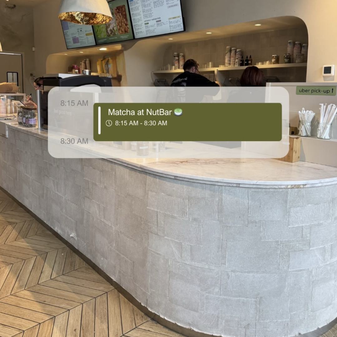 The interior of a cafe with a textured counter, with a digital graphic overlay that says 'Matcha at NutBar'.