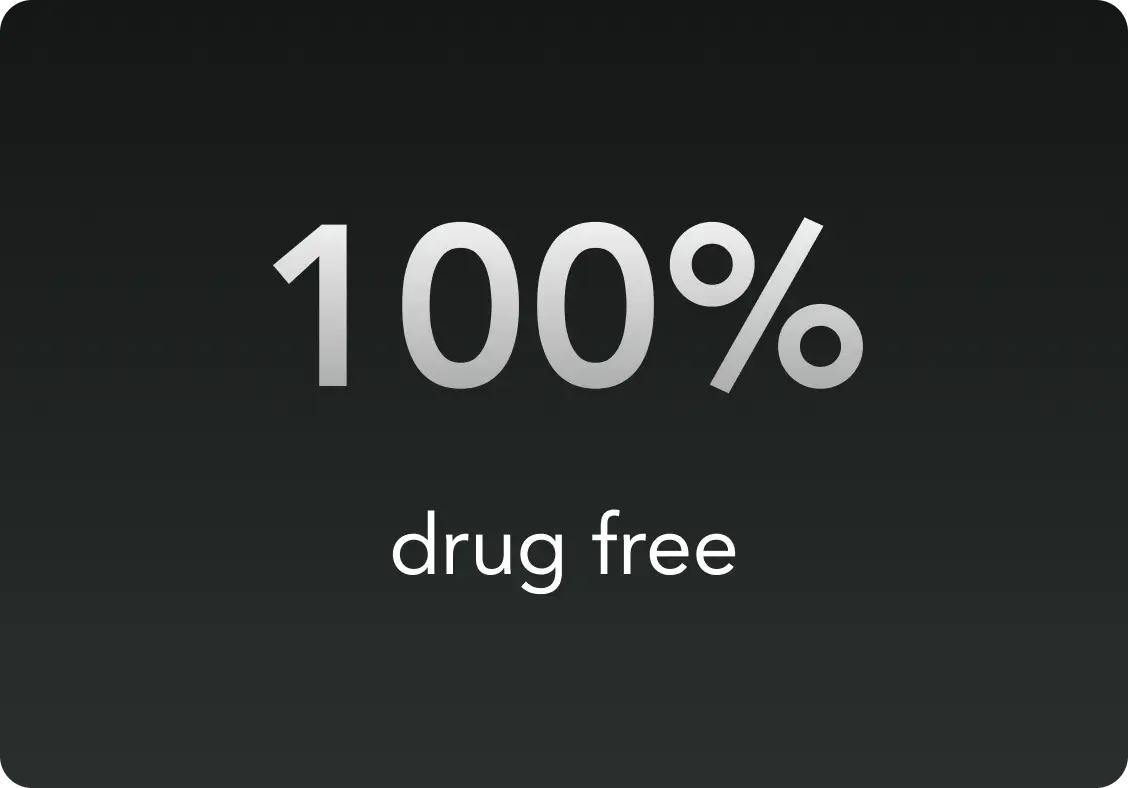 Text reading '100% drug free' on a dark background.