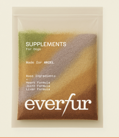 Green container labeled 'everfur' on a countertop with a glass and flower vase.