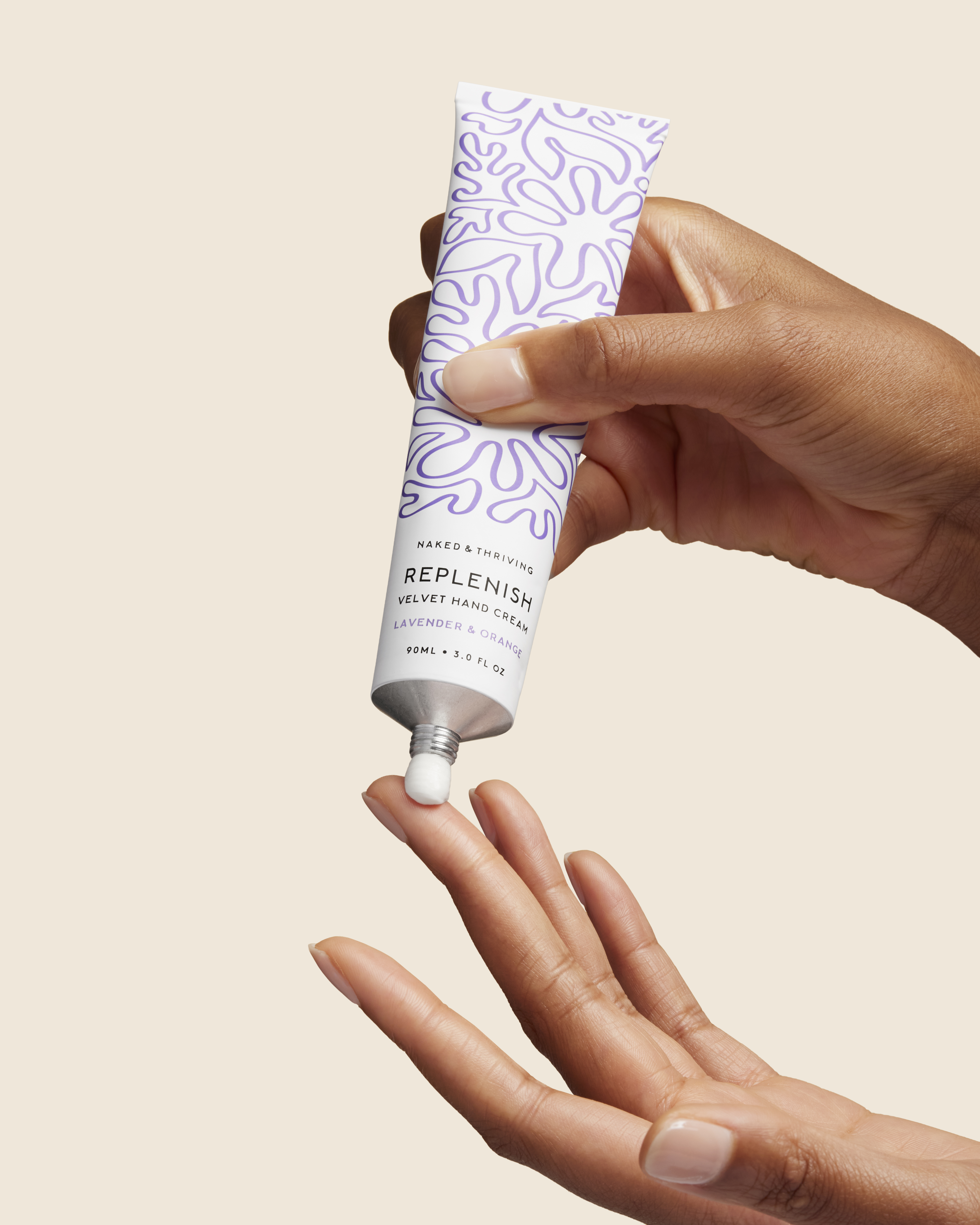 Two white pump bottles on a minimalist background with green leaves.