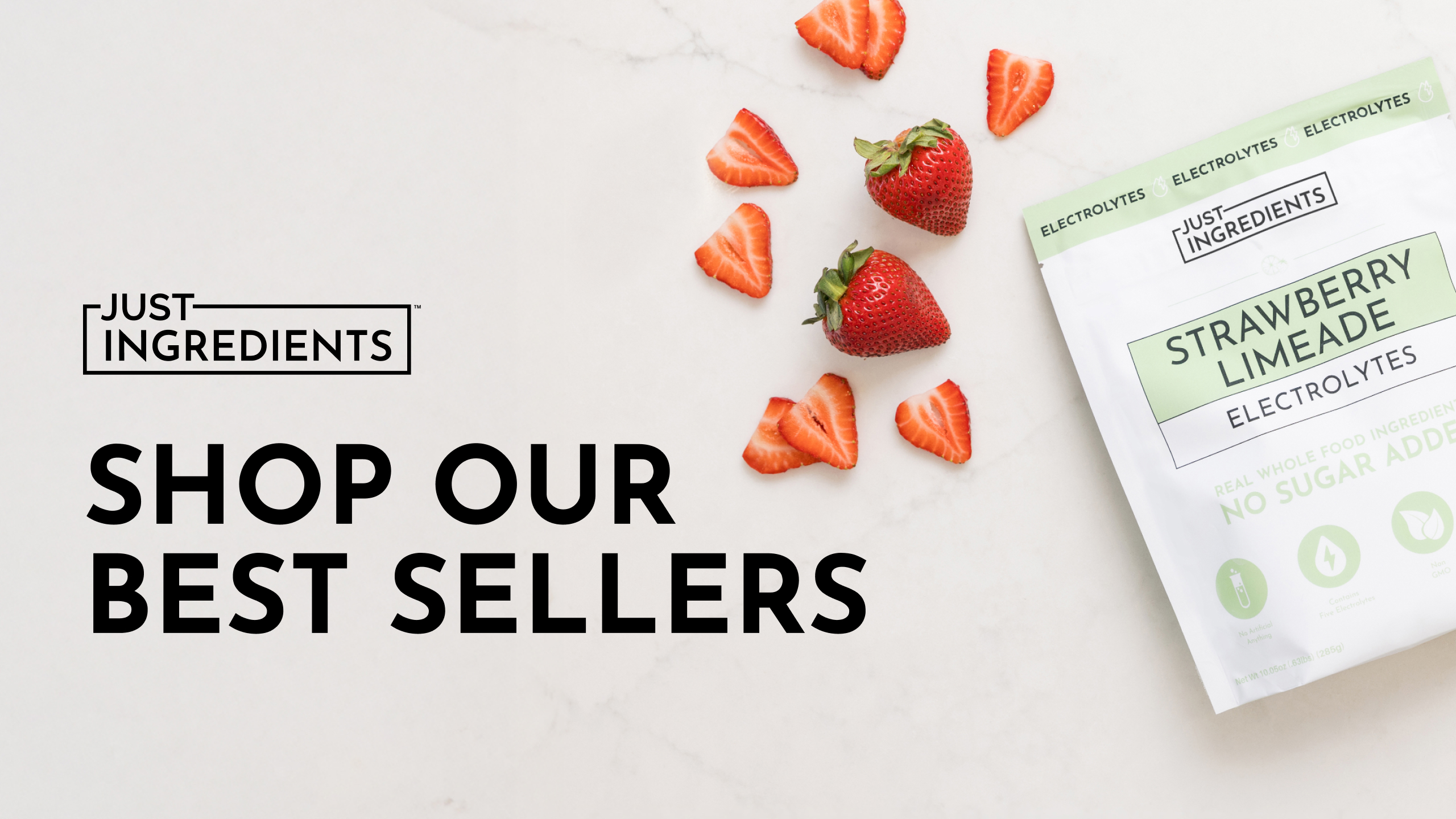 Packet of strawberry limeade electrolytes and sliced strawberries on a white surface.