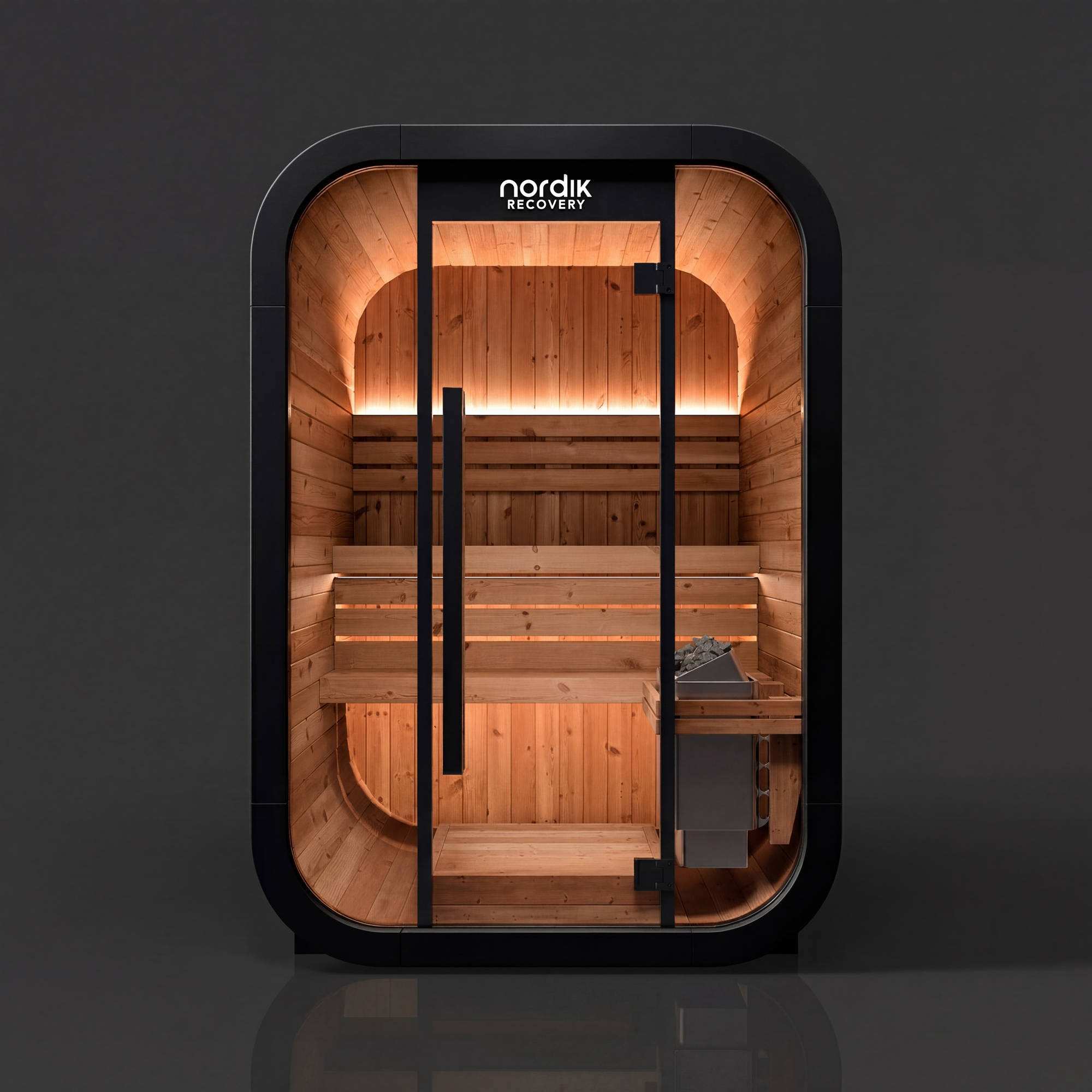 A modern, black-framed personal sauna with a capsule shape, glass door, and a lit wooden interior.