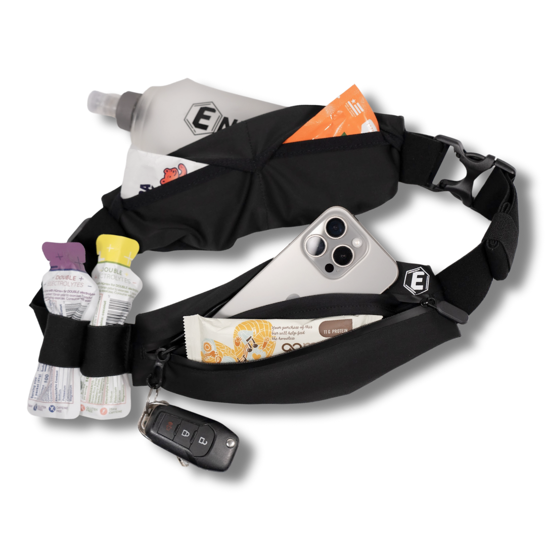 A black running belt filled with a phone, keys, water bottle, and various snacks.