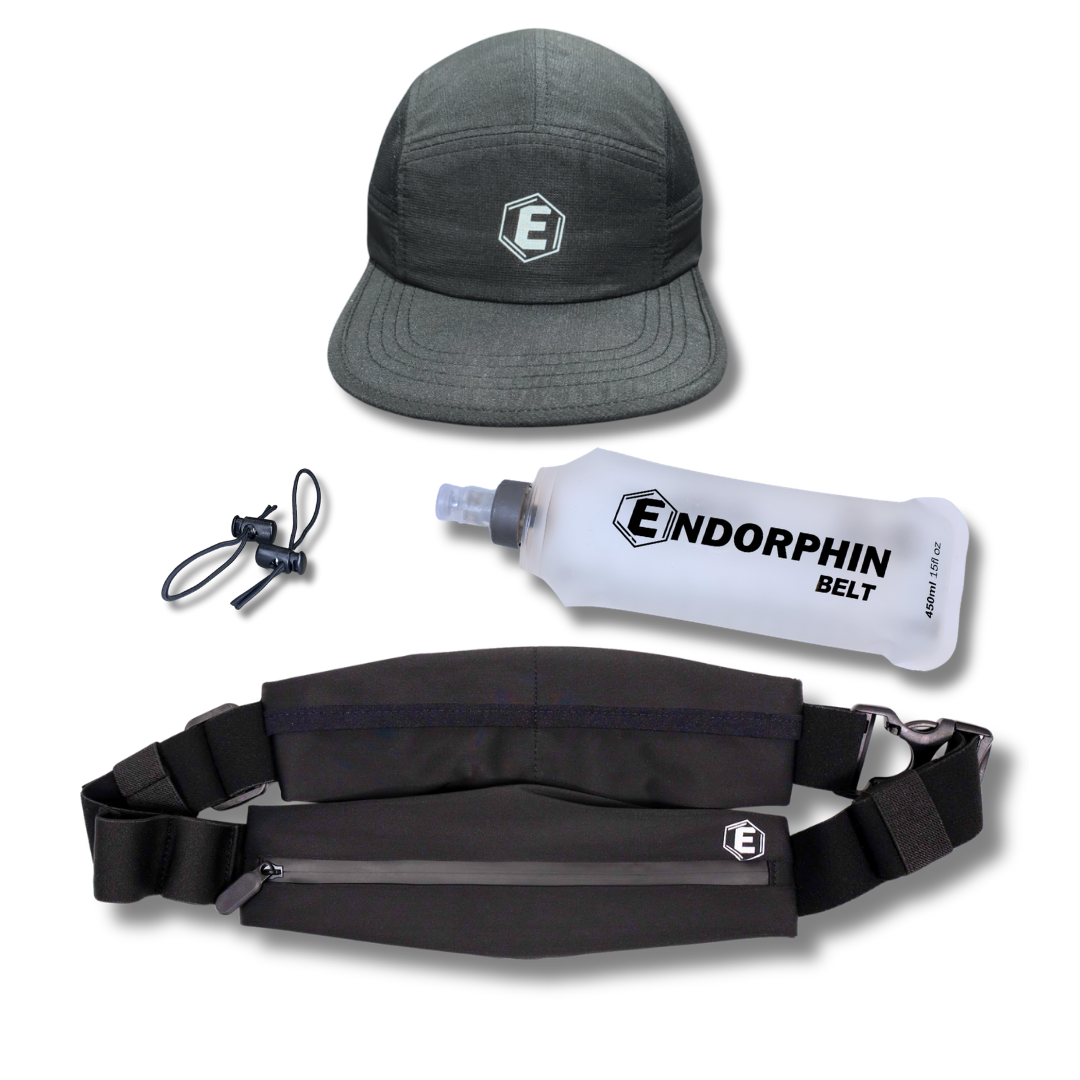 A gray running cap, a black running belt, a collapsible water bottle, and cord toggles.