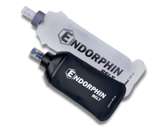 Two Endorphin Belt soft flasks, one black and one translucent white, on a white background.