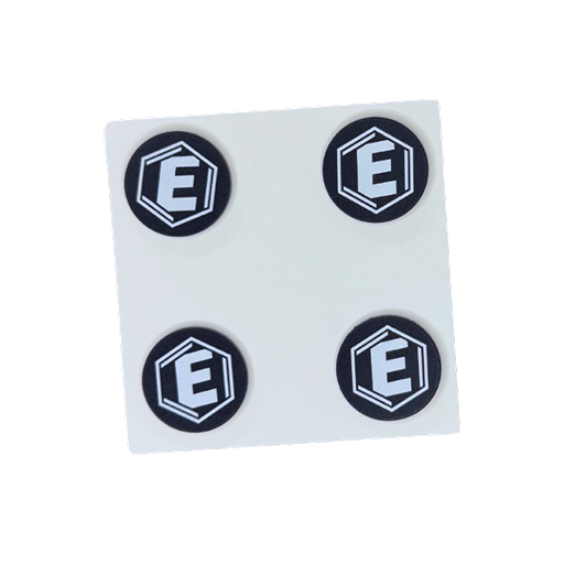 A sheet of four circular black stickers with a white letter E inside a hexagon on each.