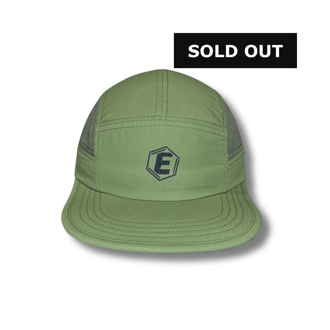 A front view of a green five-panel cap with a black hexagonal logo with the letter E.