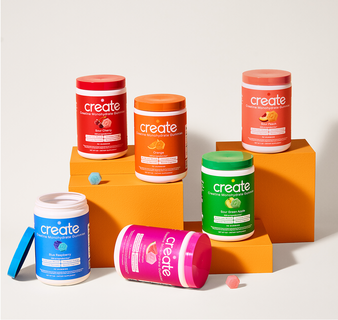 Six colorful supplement containers on stacked orange blocks.