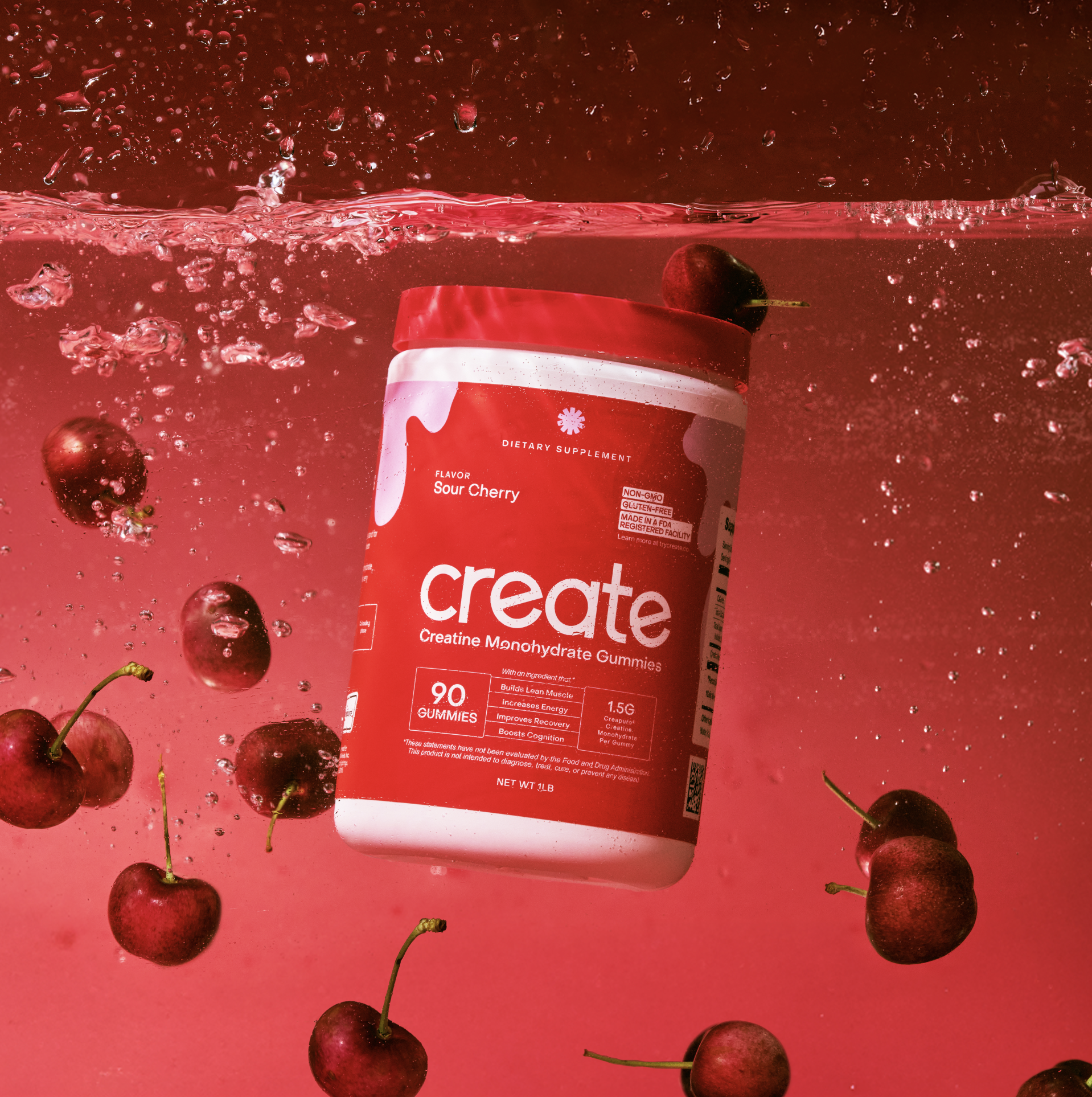 Red container of creatine gummies with cherries in water.