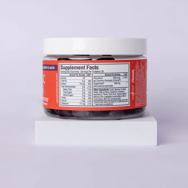 A jar of gummies with a red label showing supplement facts.