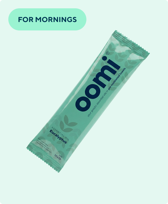 A single packet of Oomi Eucalyptus essential oil pre-moistened towels on a light green background.