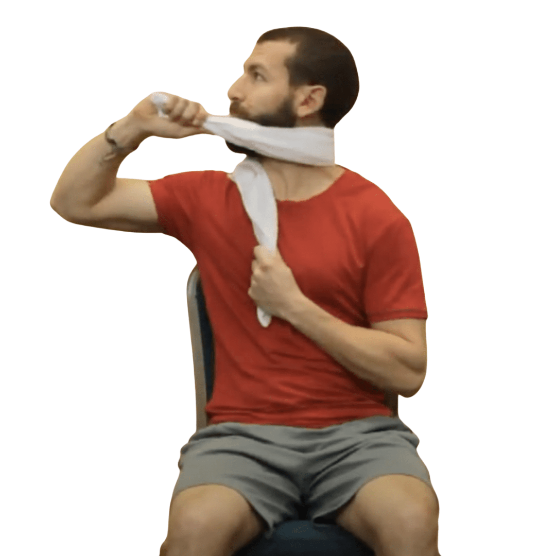A person demonstrating an exercise using a towel while seated on a chair.