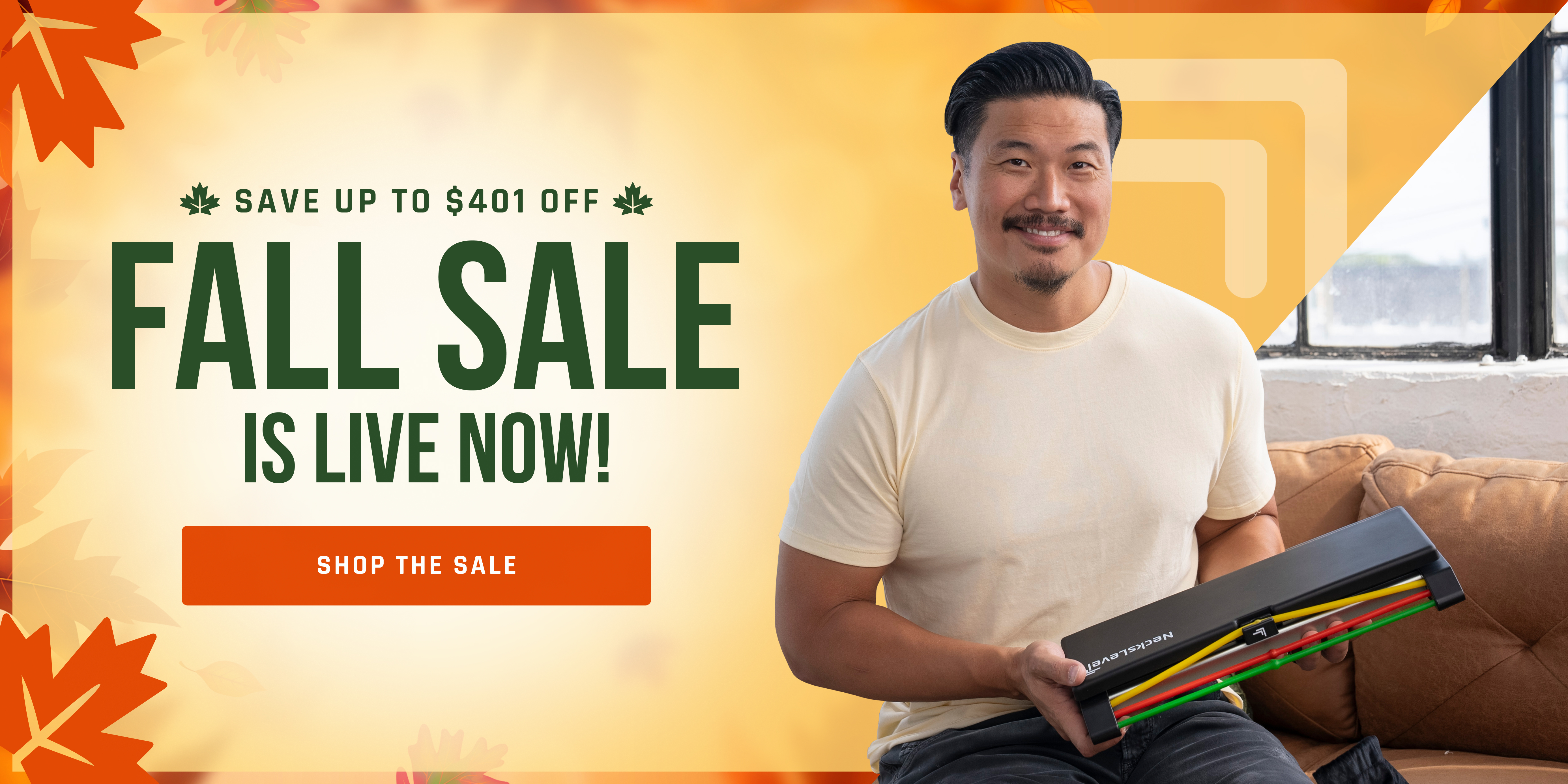 A man smiles holding a NeckLevel product on a promotional banner for a fall sale.