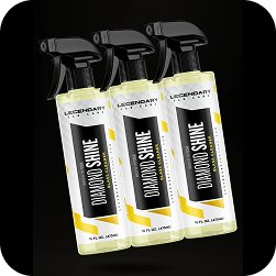 Three bottles of Legendary Car Care Diamond Shine glass cleaner spray against a black background.