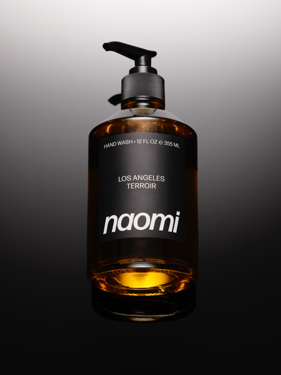 Amber bottle of liquid soap with black pump and label.