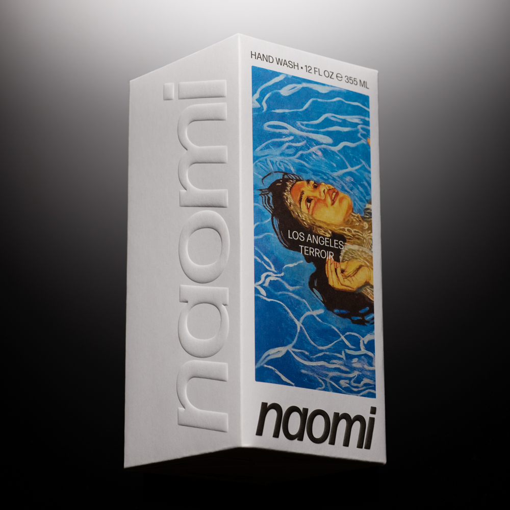 White box with 'naomi' and colorful artwork of a woman in water.