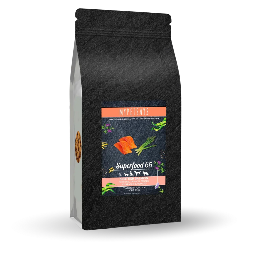 Black pet food bag labeled 'Superfood 65' with salmon and vegetables illustration.