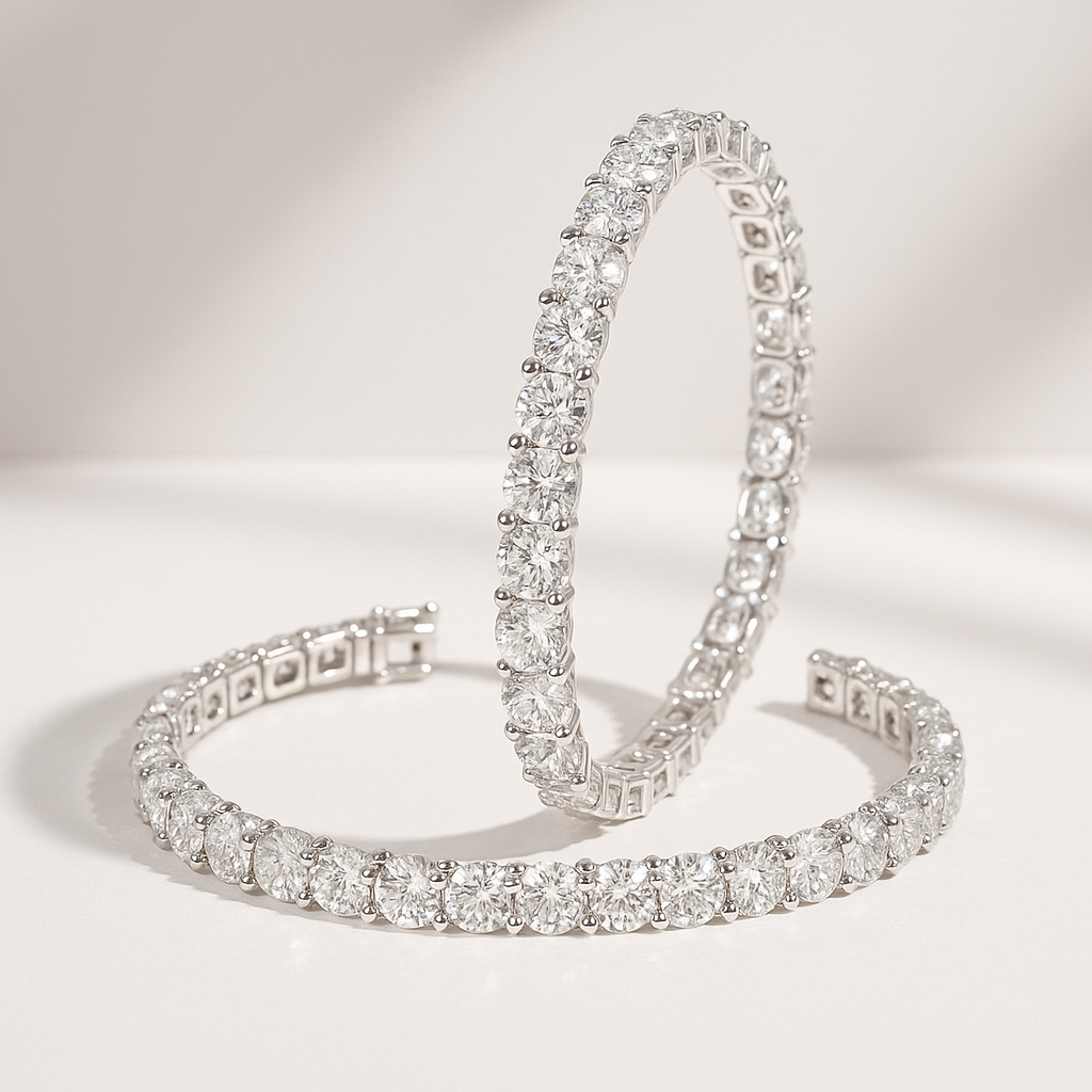 Two diamond tennis bracelets displayed on a white surface.