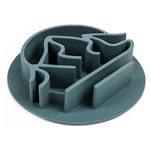 A gray, circular slow-feeder insert with a maze-like pattern on a white background.