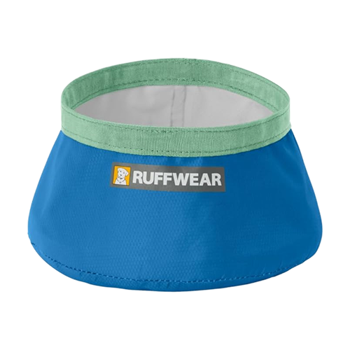 A blue, collapsible fabric Ruffwear dog bowl with a light green rim against a white background.