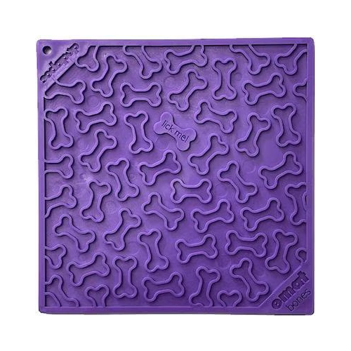A square purple lick mat for dogs with a raised pattern of bones on it.