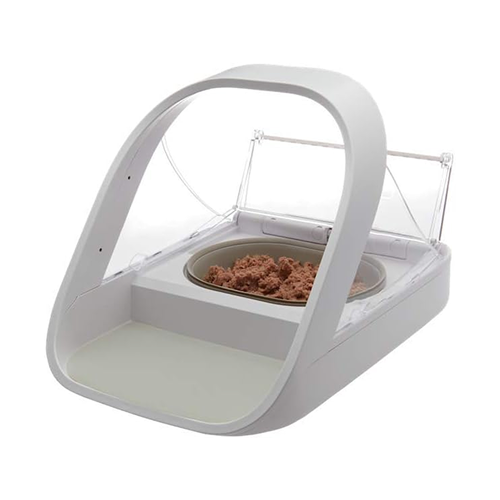 A white automatic pet feeder with an open clear lid, containing wet pet food on a white background.