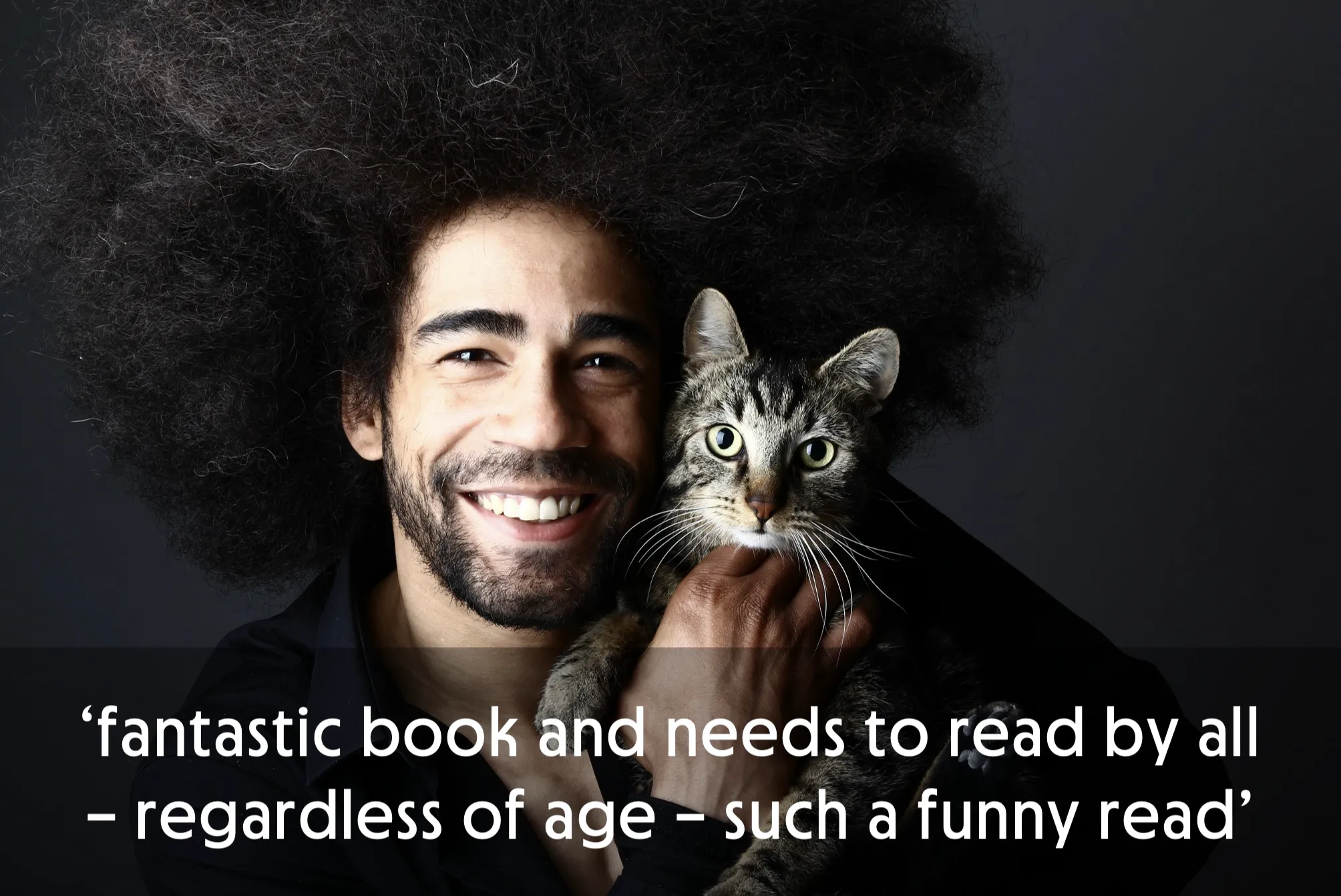 Smiling person with large hair holding a tabby cat, text overlay about a book.