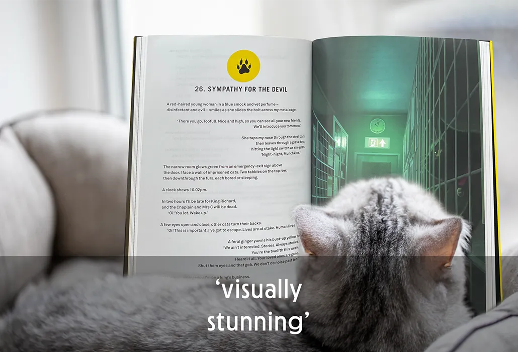 Cat reading the Thunderpaws chapter titled 'Sympathy for the Devil' with the opening image of a cat caged, with the quote “visually stunning.”