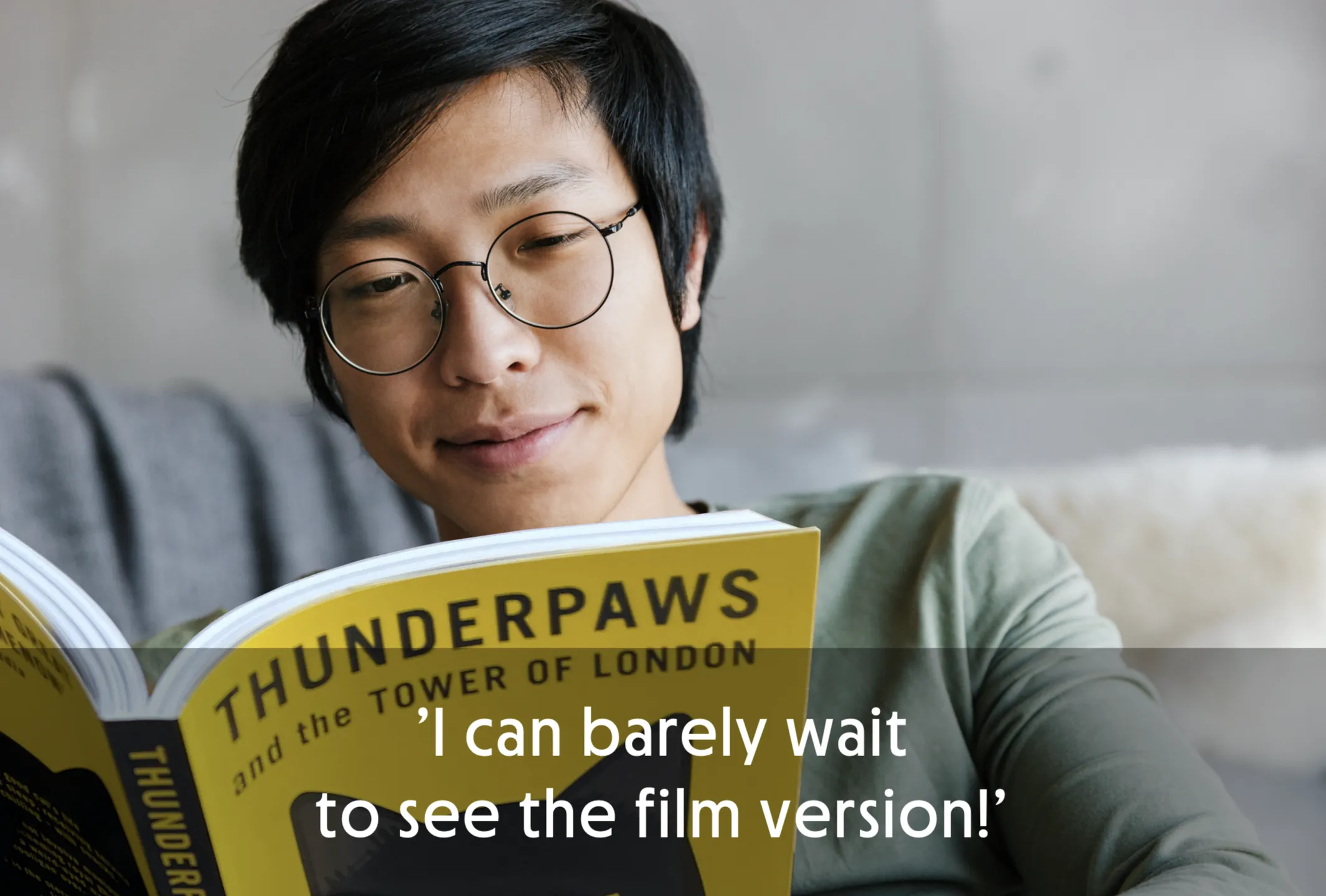 Person reading a book titled 'Thunderpaws and the Tower of London' with a quote overlay.