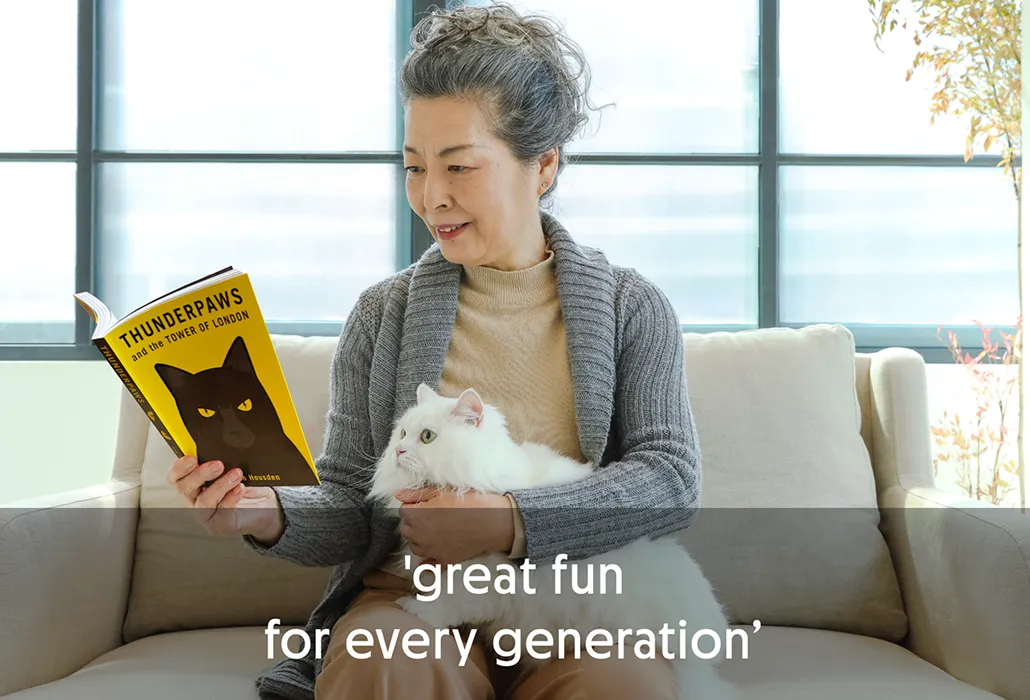 Older woman reading a book with a white Persian cat on her lap, with the quote “great fun for every generation”