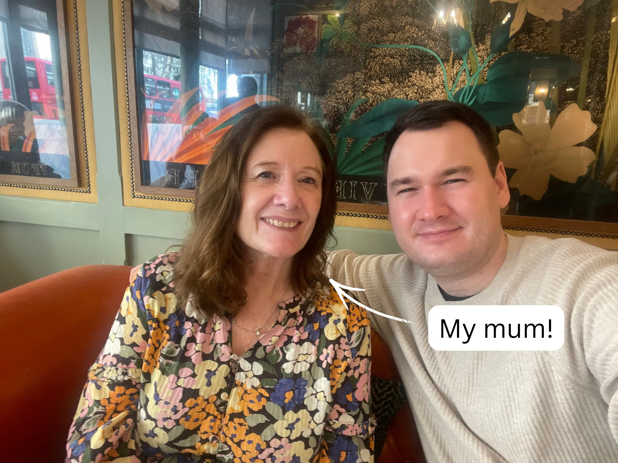 A man takes a selfie with a woman, with a text bubble pointing to her saying 'My mum!'