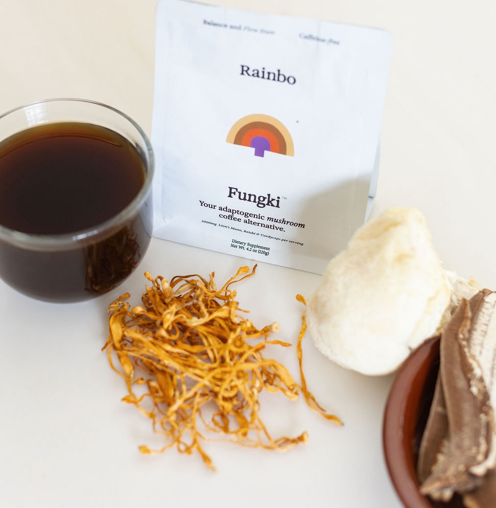 Mushroom coffee alternative with dried mushrooms and a cup of dark liquid.