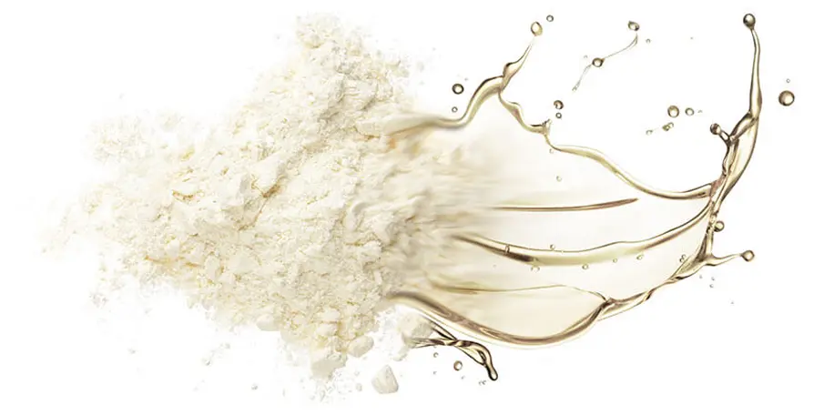 White powder and liquid splash on a white background.