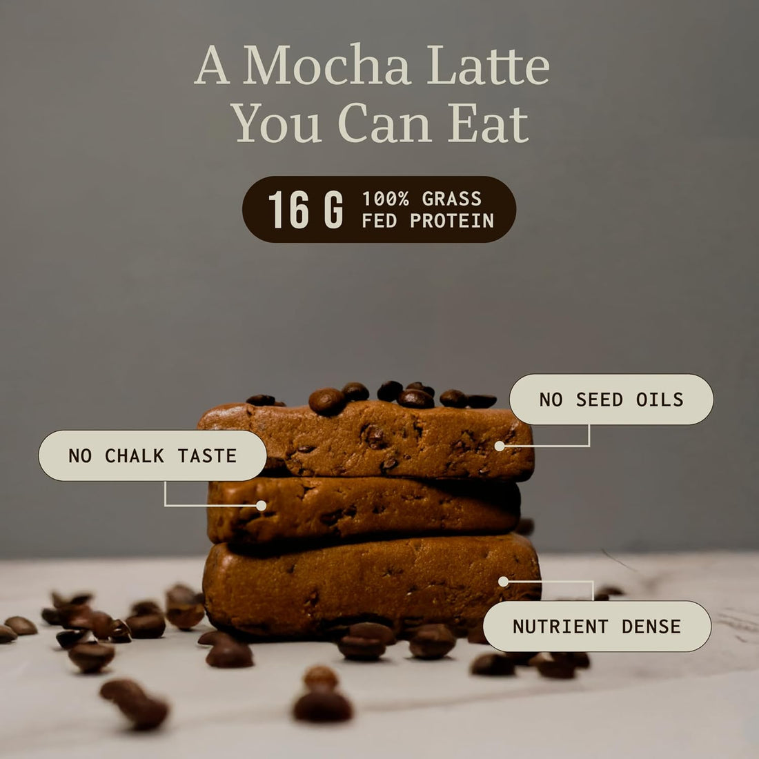 Stacked protein bars with coffee beans, labeled as nutrient dense and no seed oils.