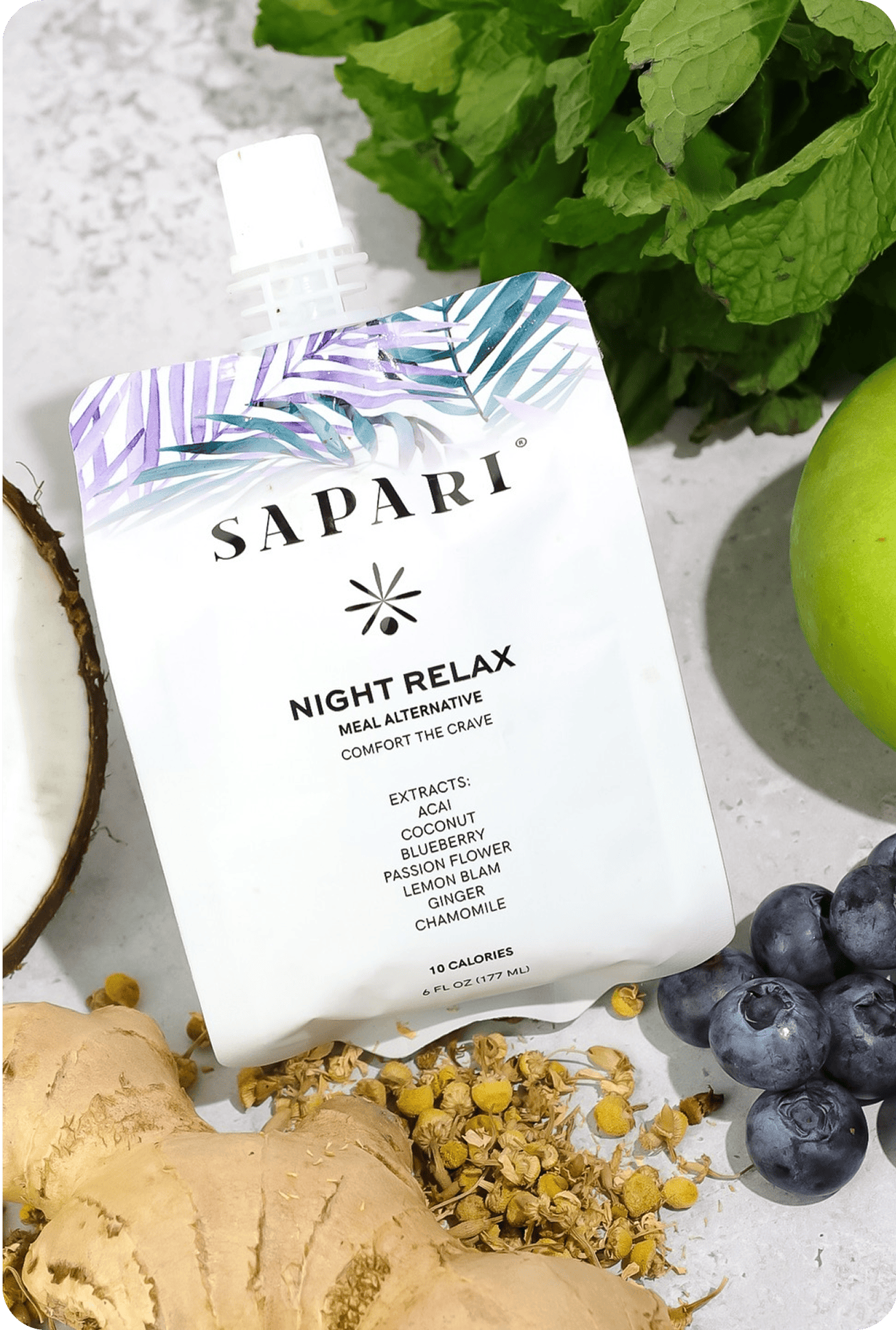 Pouch labeled 'Sapari Night Relax' surrounded by ginger, blueberries, mint, and chamomile.