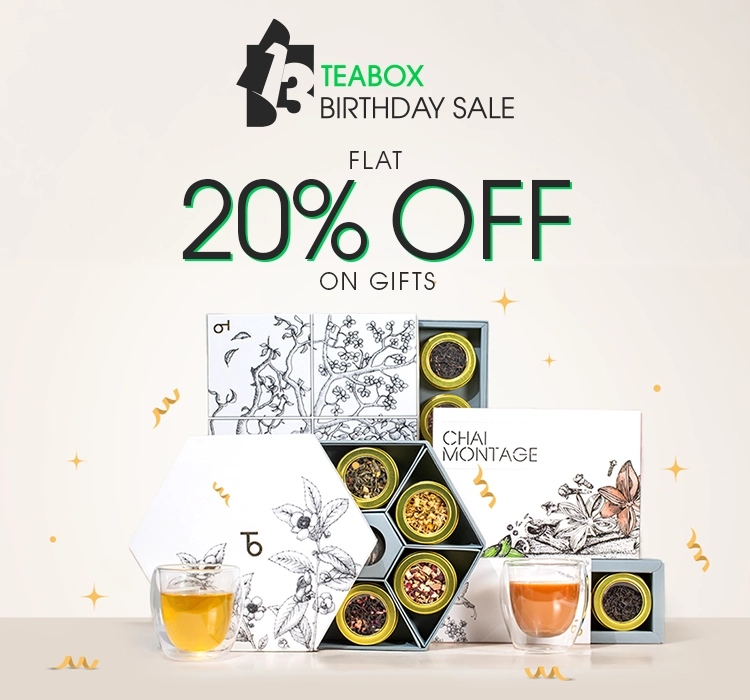 A promotional image for Teabox Birthday Sale showing various tea gift sets and two glasses of tea.