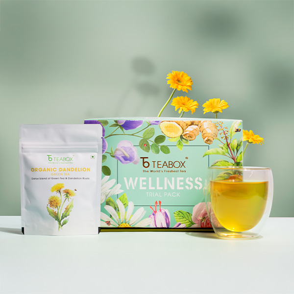 Teabox wellness trial pack with organic dandelion green tea and a glass of tea.