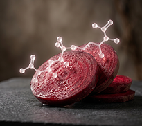 Slices of red beetroot on a dark surface with white molecular structures superimposed on top.