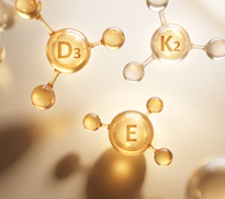 Golden molecular structures representing vitamins D3, K2, and E against a blurred golden background.