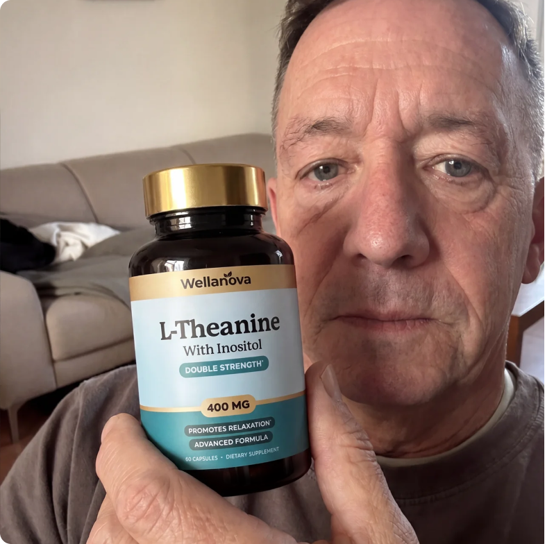A man holds up a bottle of Wellanova L-Theanine with Inositol supplements to the camera.